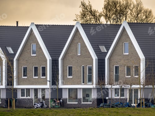Preview: Row of modern houses at sunset