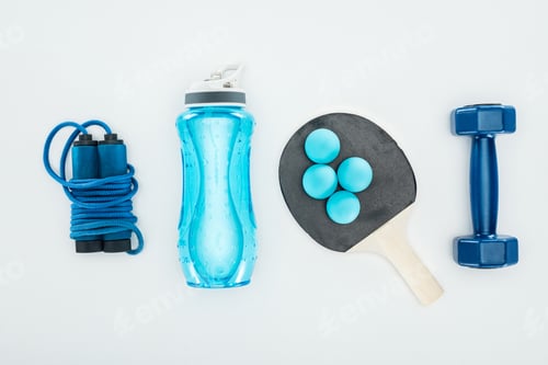 Preview: top view of sport bottle near ping pong balls and sport equipment isolated on white