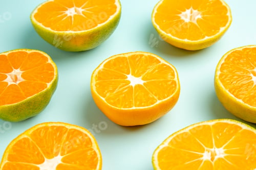 Preview: front view fresh tangerine slices on light-blue background photo fruit color juice citrus orange