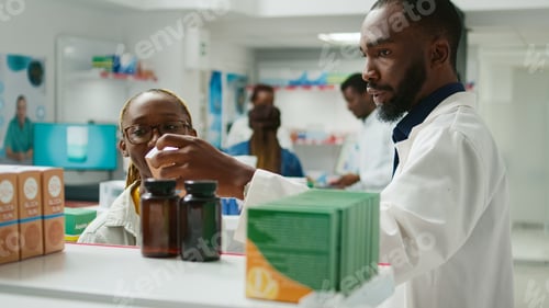 Preview: Health specialist recommending pills to customer