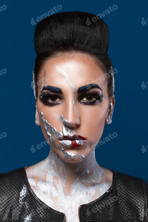 Preview: Girl With Creative Make-Up On A Blue Background