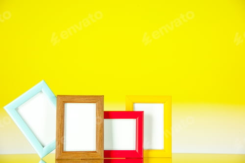 Preview: front view different picture frames with colored corners on yellow background present picture family