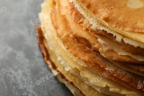 Preview: Delicious thin pancakes on black smokey background