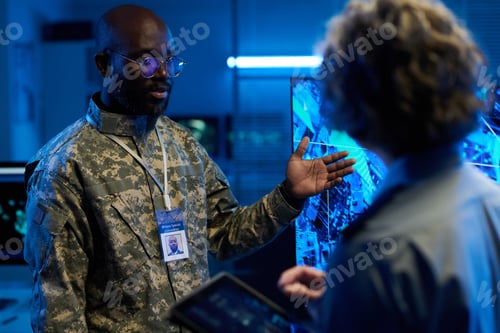 Preview: Officer pointing at interactive screen