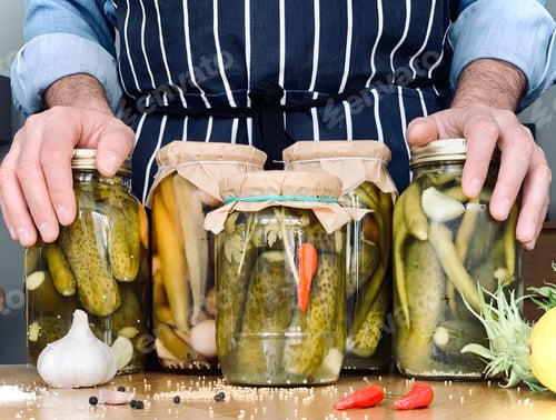 Preview: Artisanal: man is doing pickles jars stock for winter season. Organic homemade pickles