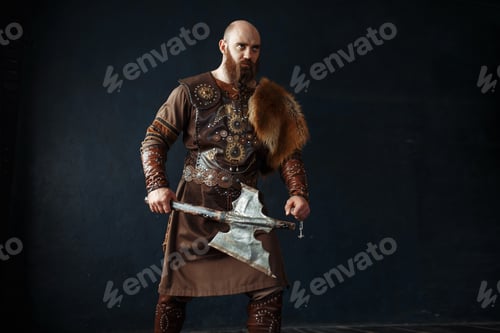 Preview: Viking with axe in traditional nordic clothes
