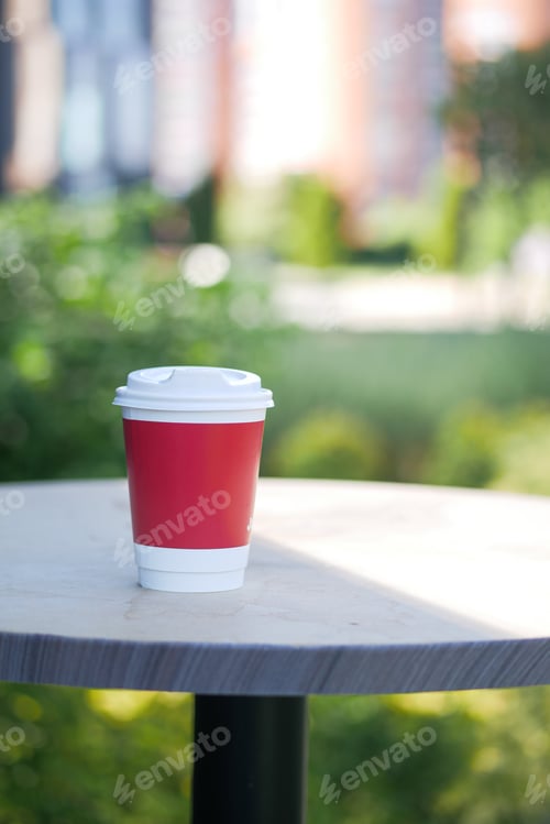 Preview: Blank take away kraft coffee cup on table ,