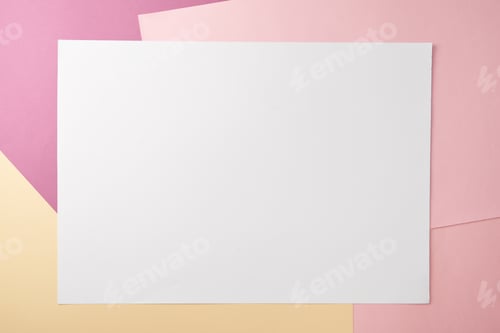 Preview: top view of blank white card and empty colored paper background