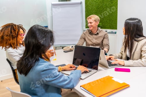 Preview: Business people working together in coworking office meeting room