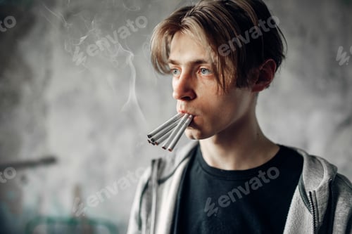 Preview: Young junkie with many cigarettes in his mouth
