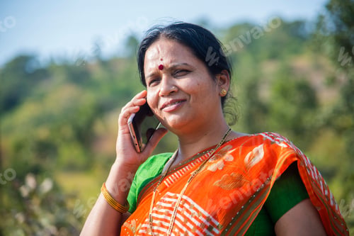 Preview: Indian woman talking on smartphone.