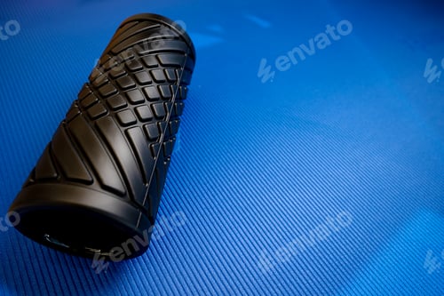 Preview: Sport fitness foam roller on blue mat