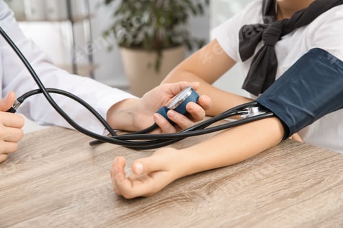 Preview: Little boy visiting doctor in hospital, closeup. Measuring blood pressure and checking pulse