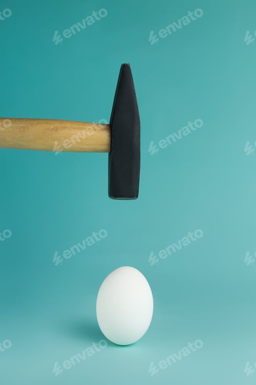 Preview: Egg and hammer hovering over it, before the hit.