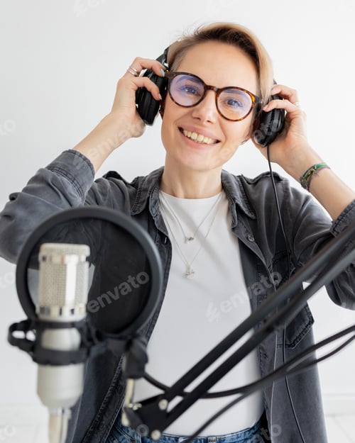 Vista previa: woman puts on headphones and creates audio content for radio or interview