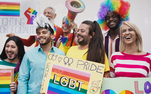 Preview: Multiracial people dance at gay pride event with banner - LGBT concept and homosexual love