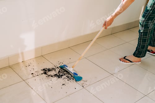 Preview: Man wiping floor with the mop.