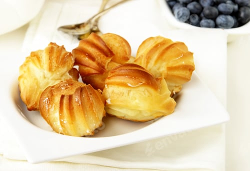 Preview: choux pastry eclairs with cream dessert