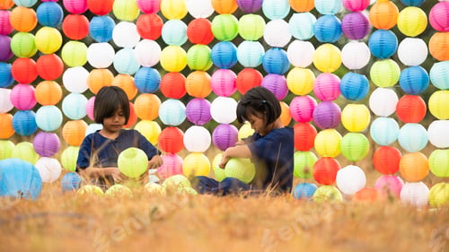 Preview: Childhood life in rural Thailand. A small child plays with colorful little hanging lamp