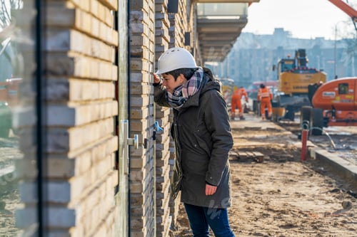 Preview: Female Construction manager walking around site inspecting work