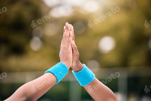 Preview: Hands of tennis players high five after a match. Closeup on hands of tennis players celebrating aft