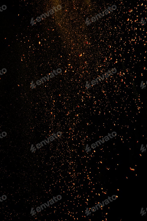 Preview: orange colorful holi paint explosion on black background