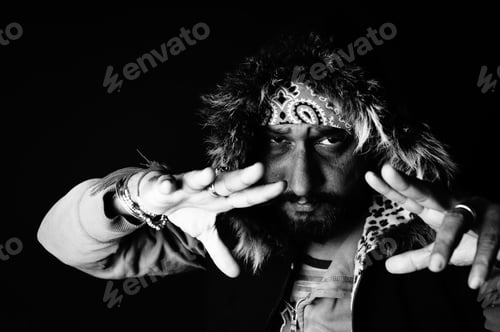 Preview: Grayscale portrait of a South Asian male with a fur hood on a dark background