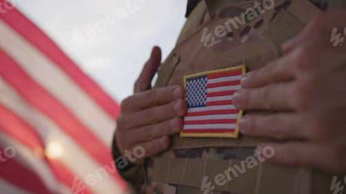 Preview: American Soldier With Flag On His Chest Of The United States During Memorial Day