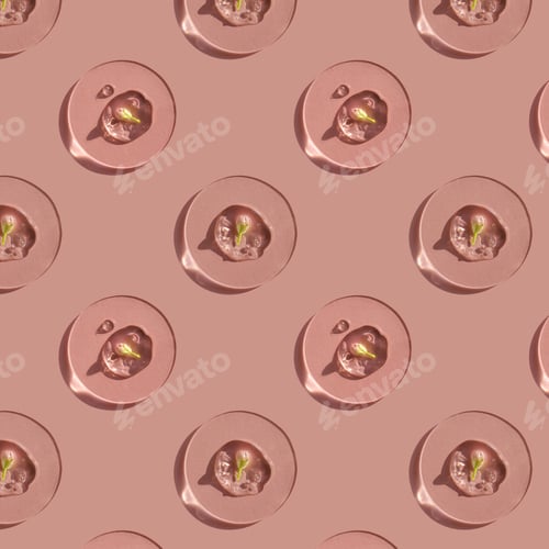 Preview: A drop of cosmetic gel with a flower on a pink background
