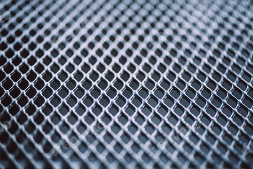 Preview: Surface of latticed metal fence. Stainless steel and aluminum light blur background. Macro texture