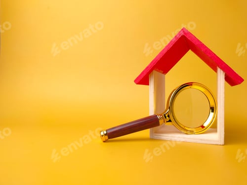 Preview: Toy house and classic magnifying glass isolated on yellow background with copy space