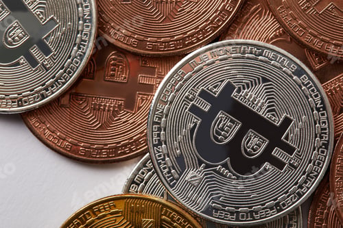 Preview: full frame shot of various bitcoins on white surface