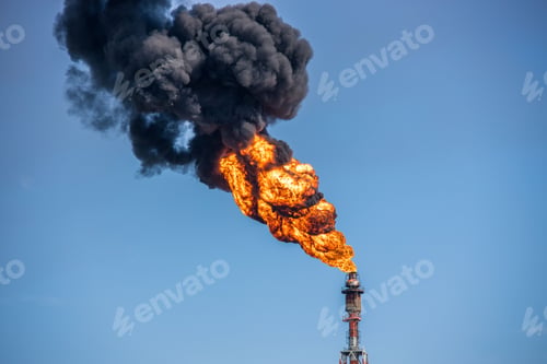 Preview: Power tower burning in the daytime.