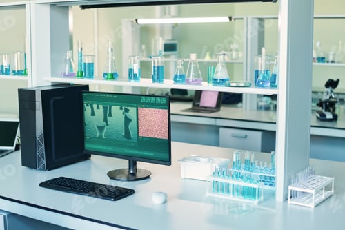 Preview: Workplace of virologist or biotechnologist with computer and test tubes
