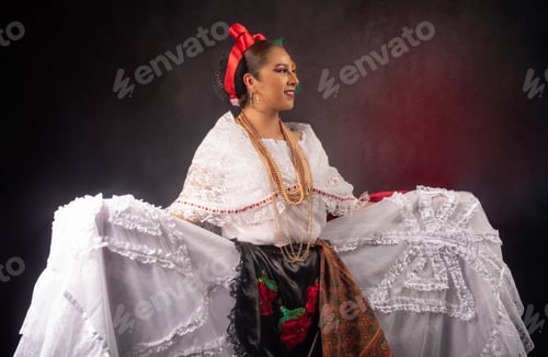 Preview: A woman in a white dress with a red bandana on her head