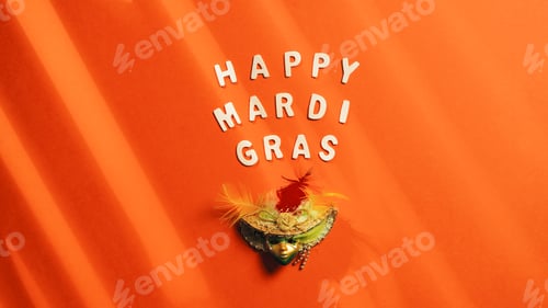 Preview: Happy Mardi Gras sign on orange Background