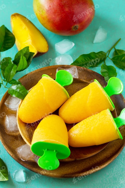 Preview: Healthy vegan orange mango citrus ice cream popsicle. Summer dessert.