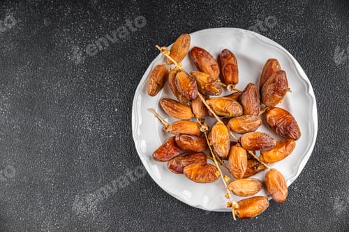 Preview: date branch dried sweet fruit fresh meal food snack on the table copy space food background rustic