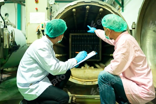 Preview: worker working in drink factory at conveyor belt with fruit juice glass bottled in production line
