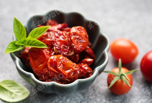 Preview: Bowl with sun dried tomatoes with fresh herbs and spices.