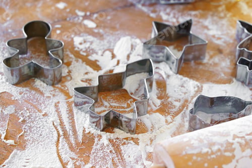 Preview: Baking Gingerbread Cookie Cutters, Wooden Rolling Pin, And Flour Are Messily Spread On Kitchen Table