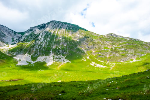 Preview: beautiful green valley with sunlight in Durmitor massif, Montenegro