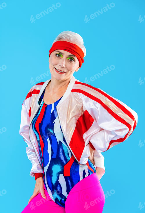 Preview: Happy and funny senior old woman on colorful background