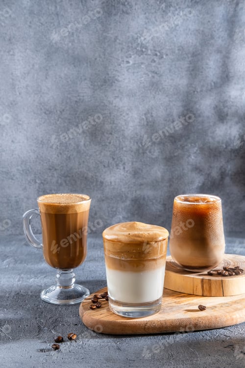 Preview: . Set with different types of coffee drinks on a dark table.