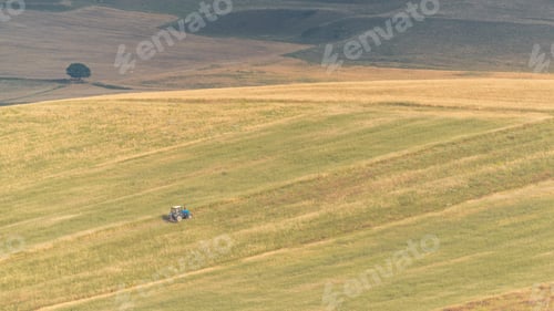 Preview: Tractor on cultivated farm fields
