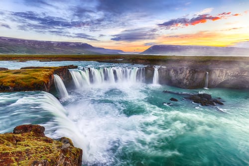 Preview: Fantastic sunset scene of powerful Godafoss waterfall.
