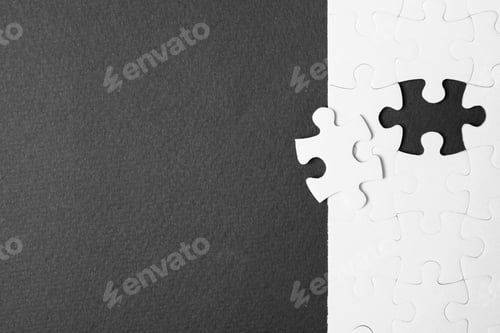 Preview: Blank white puzzle with separated piece on black background, flat lay. Space for text