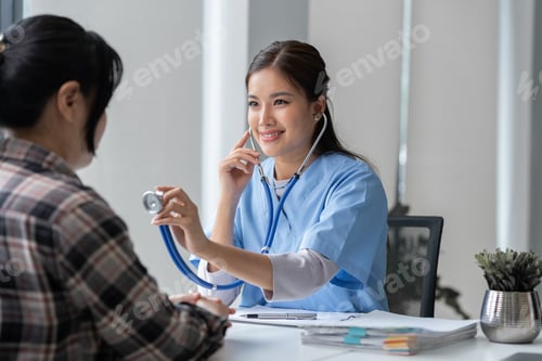 Preview: Asian female doctor using a stethoscope to examine a patient, ask for information, give advice, comf