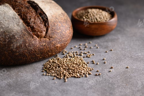 Preview: Healthy Hemp bread, hempseeds on brown background.