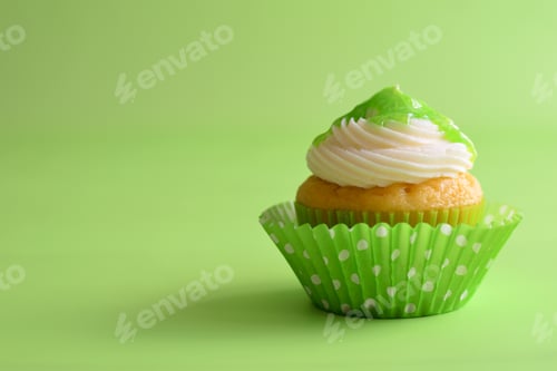 Preview: Single Vanilla Cupcake on a Green Background